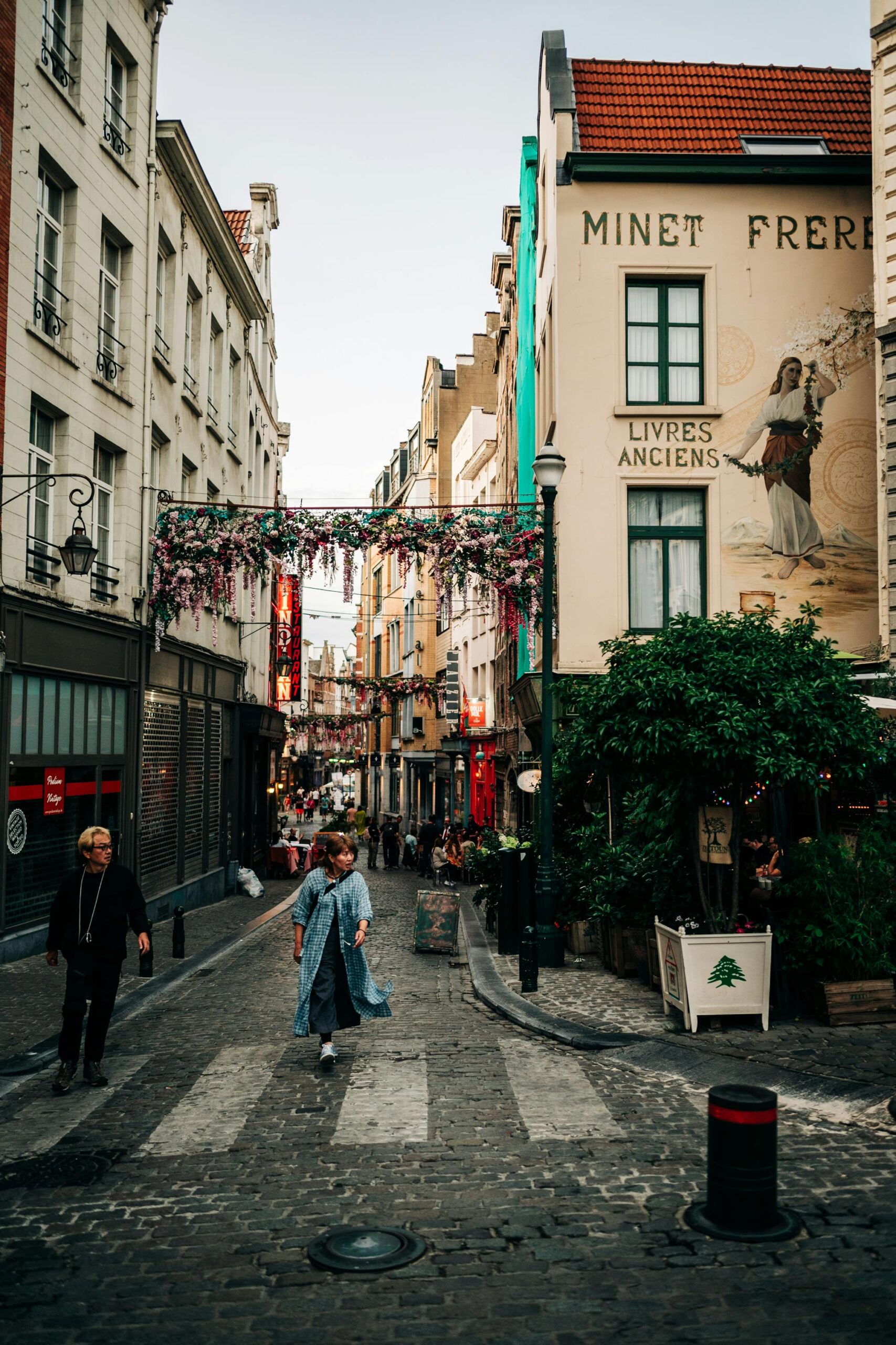 Woman Walking Among Tenements in Brussels